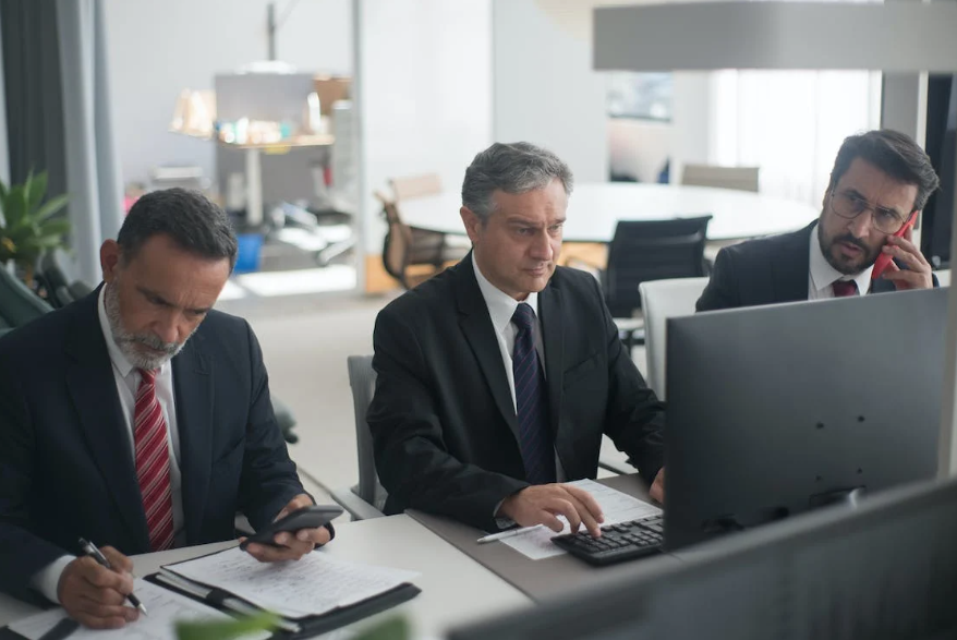 Men in Corporate Attire Working in an Office