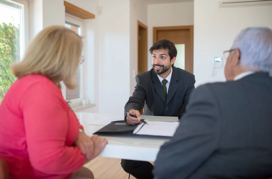 Salesman Discussing Real Estate to a Senior Couple